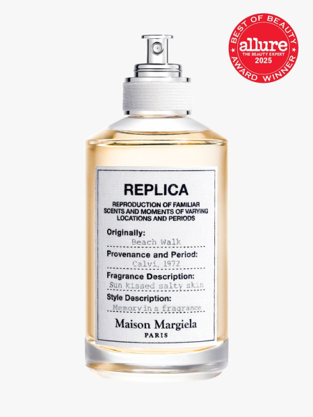 Maison Margiela Fragrances REPLICA Beach Walk Eau de Toilette in clear glass bottle with spray pump on light gray background with red Allure Best of Beauty seal in the top right corner